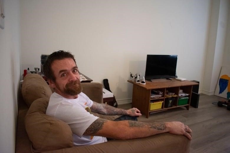 A man sitting on a couch.