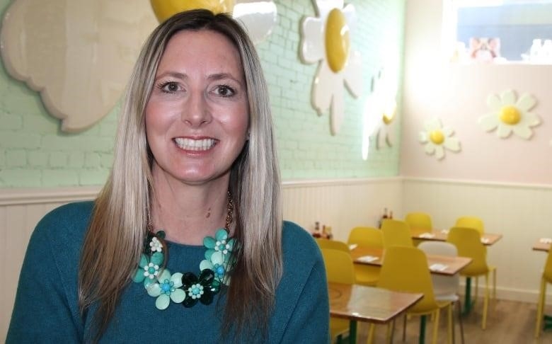 Dawn Chapman stand in her restaurant, Lazy Daisy's Cafe in Toronto,