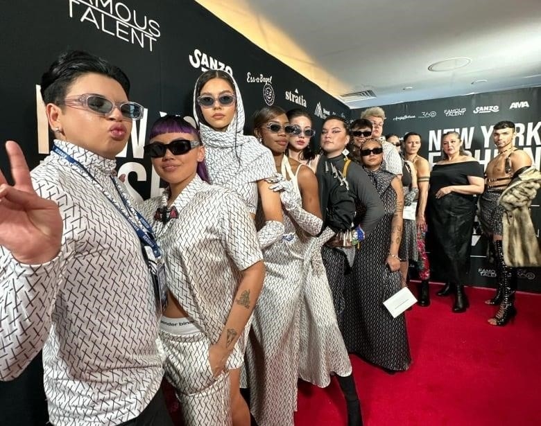 Wabano and models posing for red carpet at New York Fashion Week
