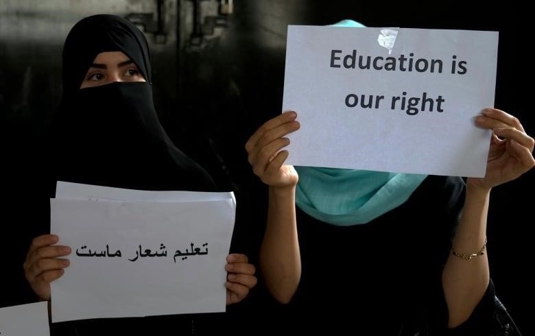 Afghan girls hold an illegal protest to demand the right to education in a private home in Kabul, Afghanistan on Aug. 2, 2022. For most teenage girls in Afghanistan, it’s been a year since they set foot in a classroom. With no sign the ruling Taliban will allow them back to school, some girls and parents are trying to find ways to keep education from stalling for a generation of young women.
