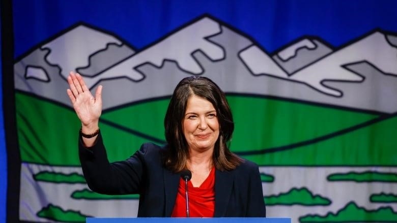 Danielle Smith waves to the crowd.