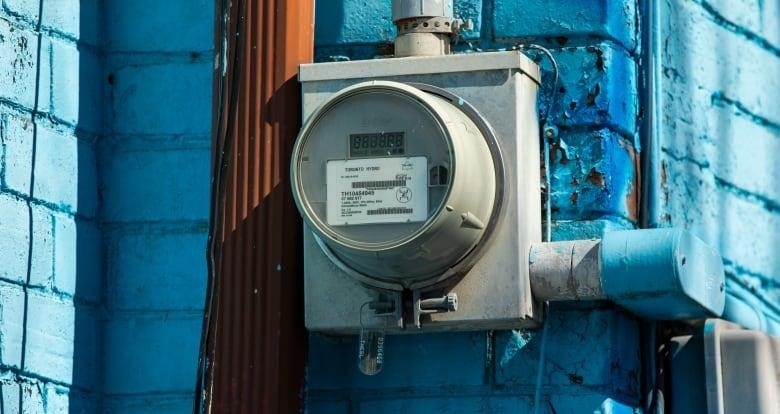 Electricity meter on exterior wall of a house