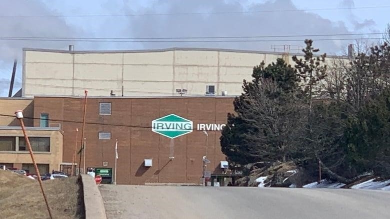 A brown building with a green Irving logo on the side