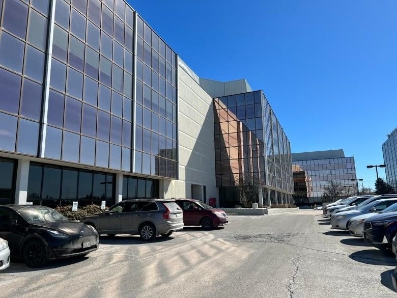 A photo taken from the parking lot of a low-rise commercial building with glass exterior which is Isabella Dan's law office in Markham. Her colleagues reported her missing after she didn't show up to work.