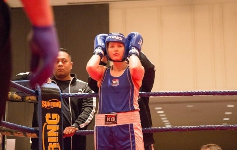 Clark holds her head in the midst of her fight in the 2017 Canadian National Championships.