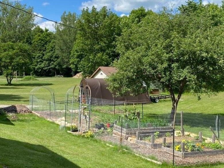 A vegetable garden is shown on a large rural property in the Township of Madoc.