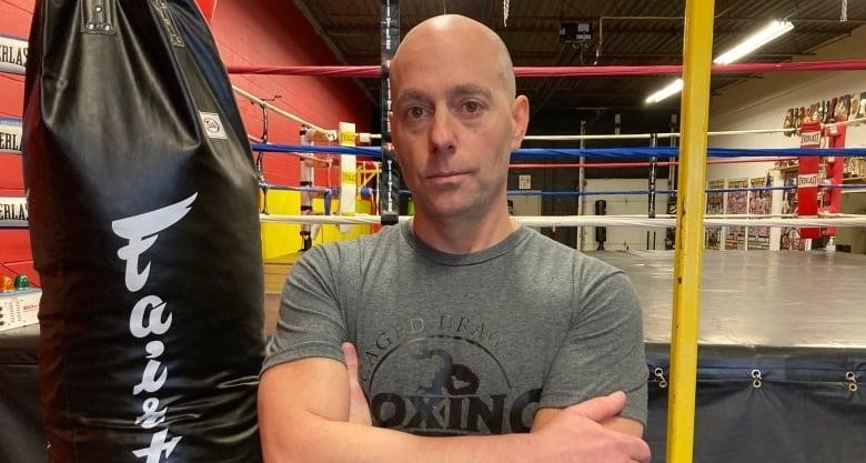Michael Williamson was the vice-president of Ontario Boxing until last year. He stands in the boxing gym he owns in Brantford, ON.