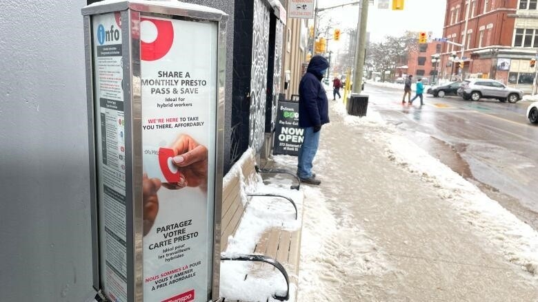An OC Transpo advertisement reminds riders they can share their monthly Presto cards, saying it's "ideal" for hybrid workers. 