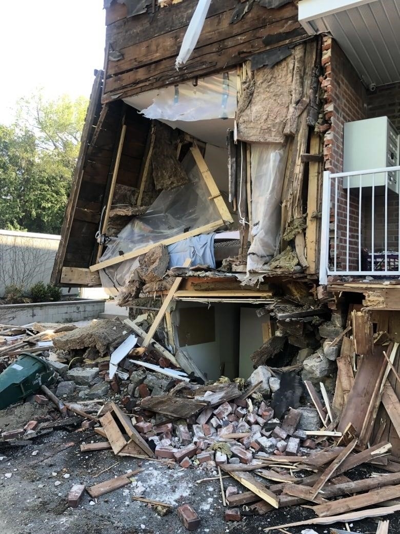 Engineers deemed the Nelson Street building inhabitable, said Duong Hoang. A mattress and blue blanket can be seen under pieces of broken wood. The apartment belonged to a student who had left for an early class the morning of the crash, said Hoang.