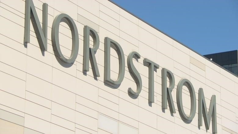 An image of the outside of the Rideau Centre. The word Nordstrom is written in grey letters. 