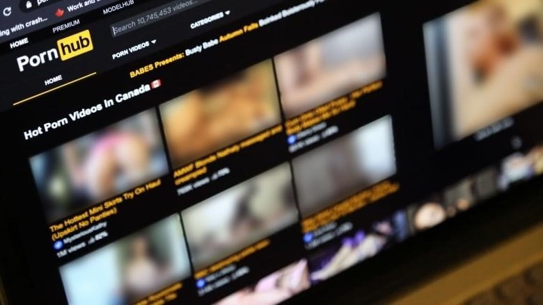 A photo of Pornhub's website. The thumbnails of videos are blurred. 
