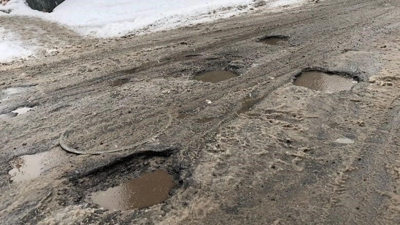 Potholes at the intersection of Somerset Street West and Bay Street in Ottawa in February 2018.