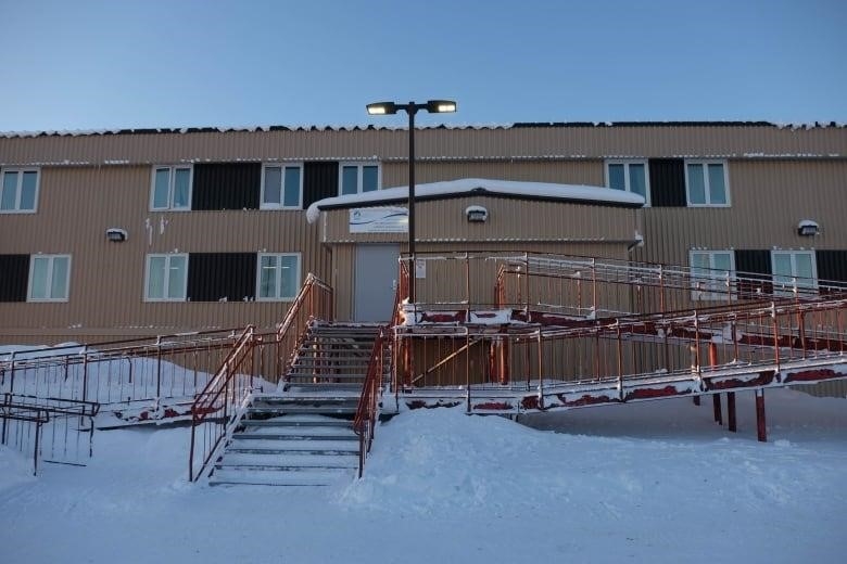 Metal-clad building with elaborate stairs.