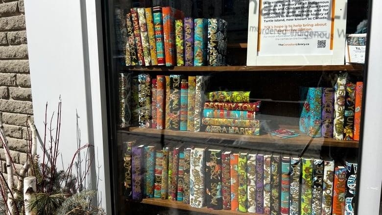 KYIS Embroidery in Strathroy, Ont's display of book shelf at their storefront window. 
