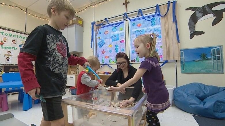 A snapshot of preschool classroom with kids playing.