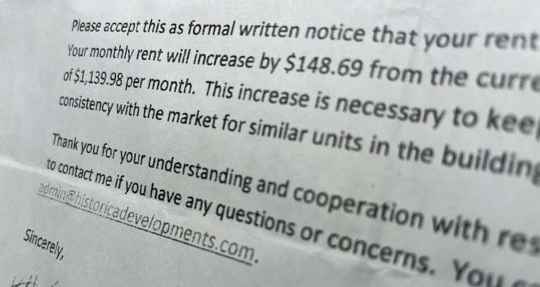 A close-up of a piece of paper detailing a rent increase
