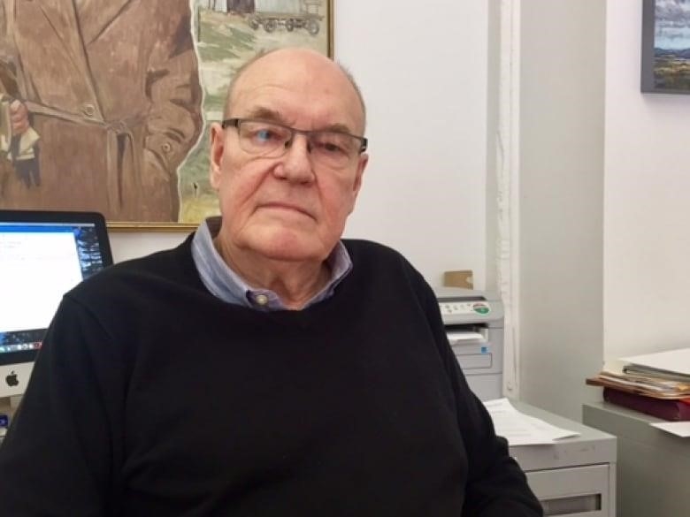 Man sitting at a desk in an office.