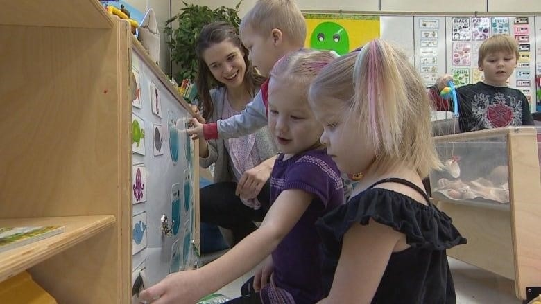 Kids playing in a preschool classroom.