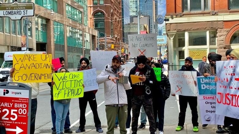 Dozens of international students protested outside the Immigration and Refugee Board in Toronto on March 30 to fight for their stay in Canada.
