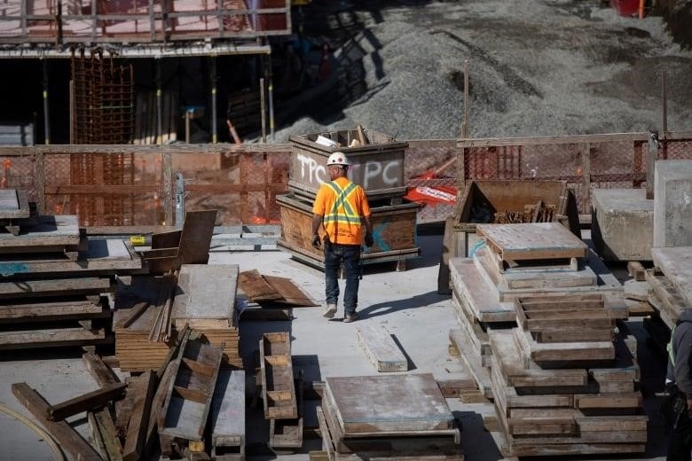 Construction crews are pictured at a development site in New Westminster.