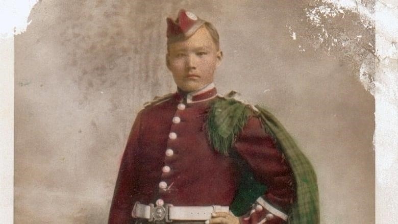 An Indigenous man in military uniform. This is a colourized version of an old black and white photograph.