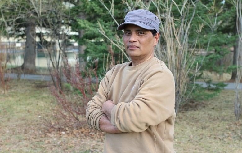 Jun Cacayuran poses for a picture in Banff, Alta. 