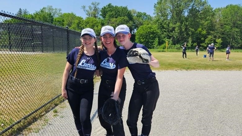 From left to right: Avery Inkster, Danika Eden, and Lexi Webster are three of 20 players on Lucas's girls softball team at Northridge Field Diamonds