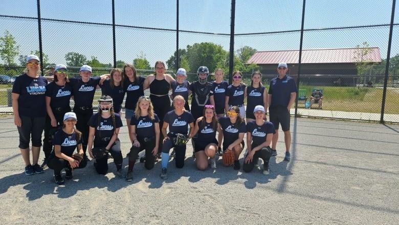 The Lucas girls softball team with their coaches Tara Wade (far left) and Cory Claypole (far right).