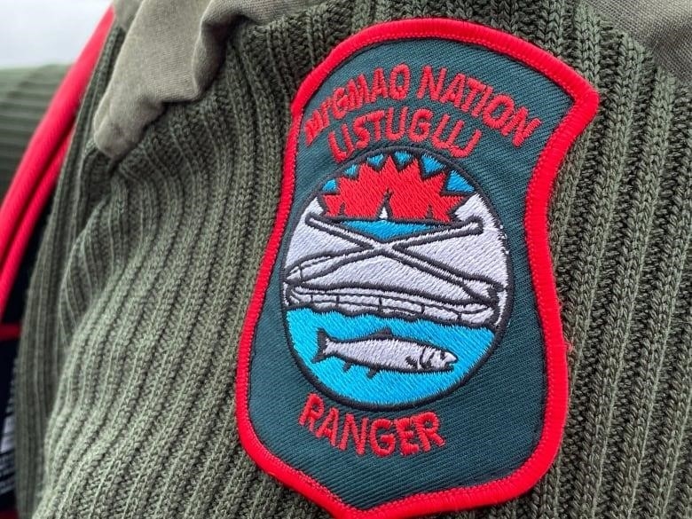 An arm badge that says "MI'GMAQ NATION LISTUGUJ RANGER"