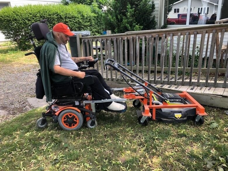 Rob Piper's wheelchair now connects to a lawnmower to allow him to cut the grass, something he loved before being injured five years ago.