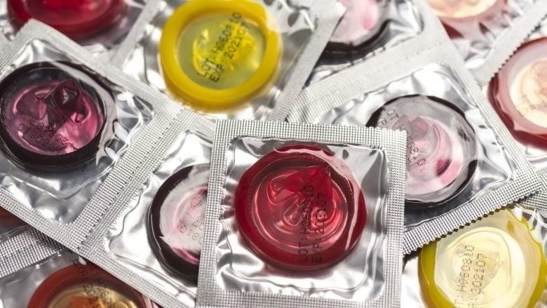 Many colourful condoms in packages