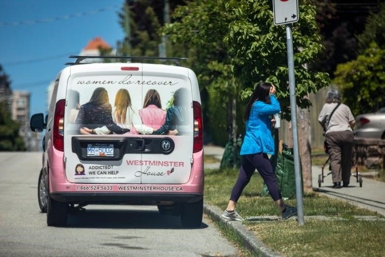 A vehicle is pictured with an ad on the back for Westminster House. A line on the bottom-left of the ad says, 'Addicted? We can help'