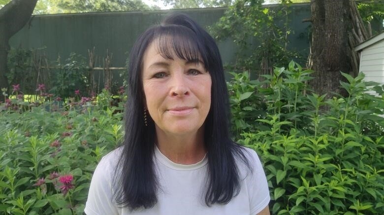 Connie Barszcz standing in a garden. 