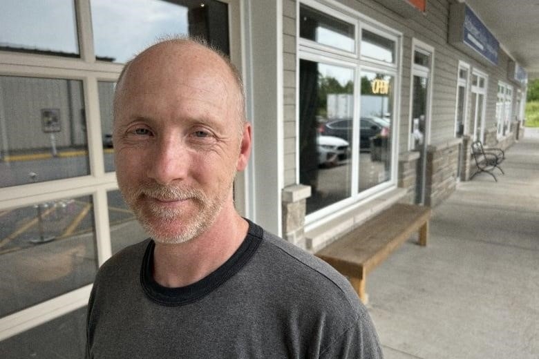 customer at Base Camp Brewing Company, Almonte, Ontario, July 2023