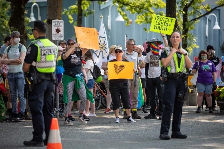 Conter protesters in support of a summer camp being held at the Carousel Theatre in Vancouver, B.C.