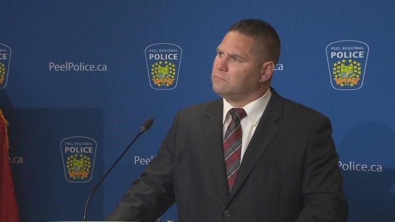 Insp. Phillip King takes questions at a press conference.