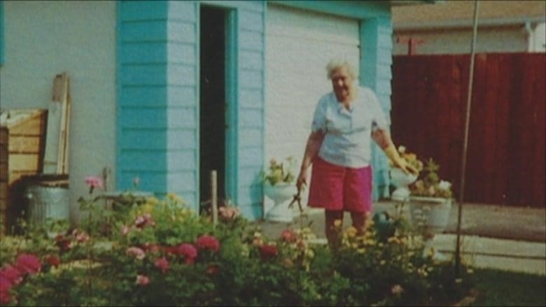 A photo shows an older woman in pink shorts watering flowers in a garden.