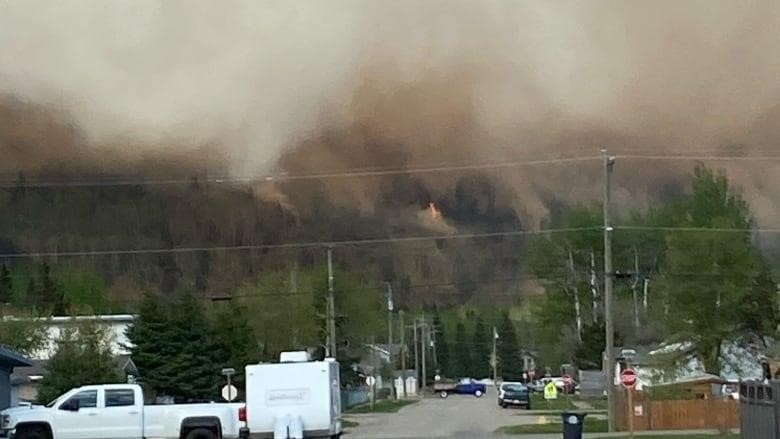 Smoke from an out-of-control wildfire filles the sky in McBride, B.C.