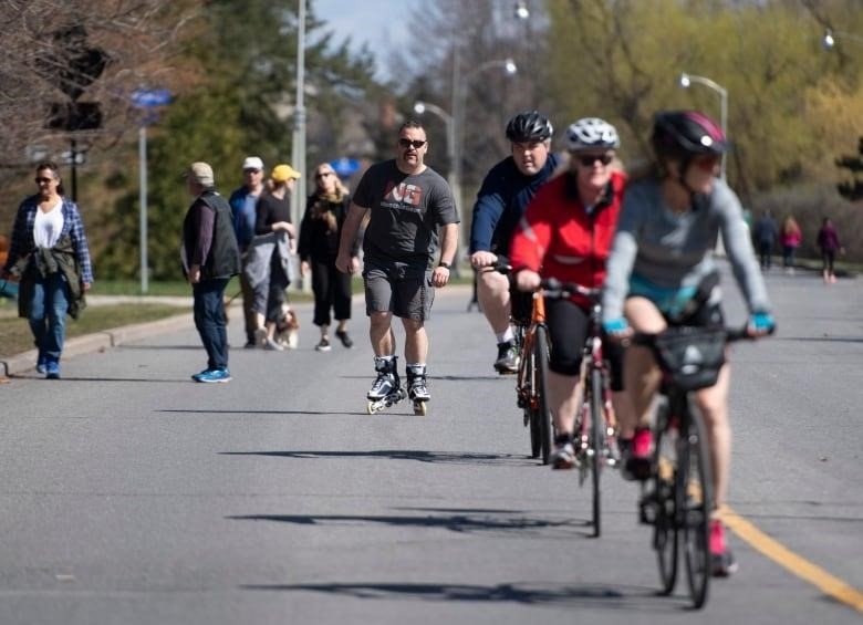People walk, ride bikes and inline skate on Queen Elizabeth Drive in Ottawa.