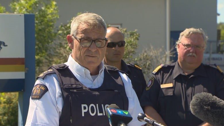 A police officer speaks at a news conference 