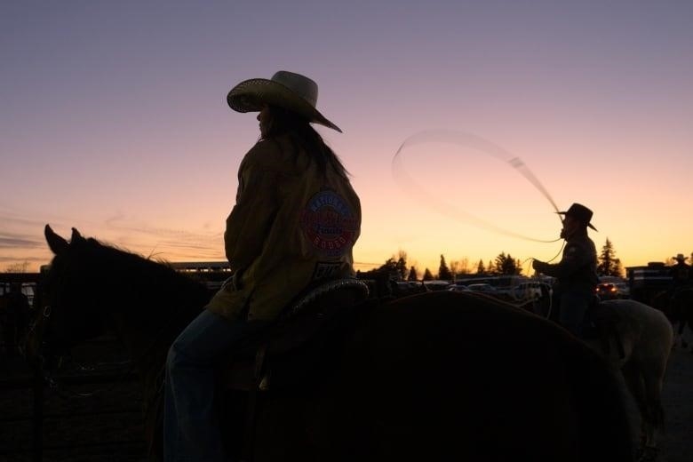 Twin sisters Taylor and Mackenzie L'Heureux train for a rodeo competition.