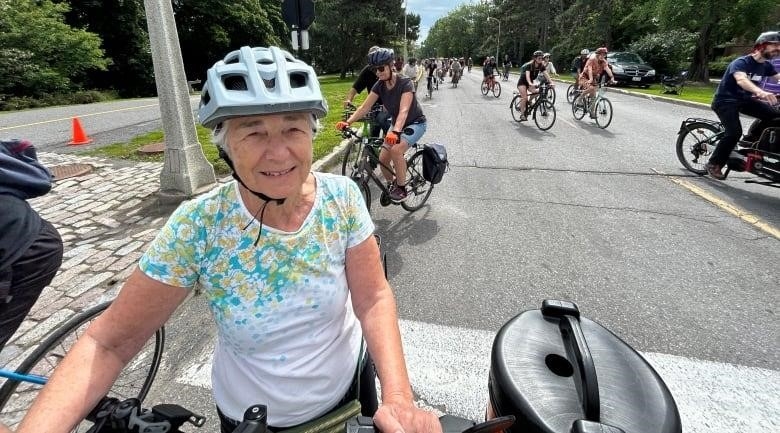 76 year old cyclist cyclists during bike rally on Queen Elizabeth Driveway, August 12, 2023
