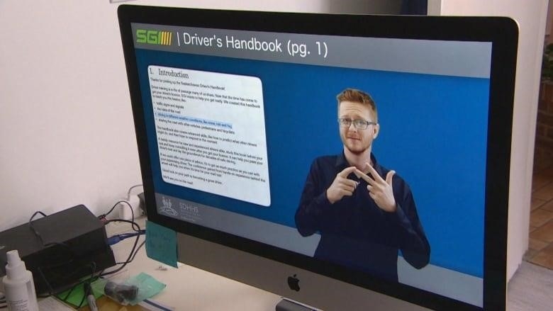 Adam Stratychuk using translating Saskatchewan's Driver's Handbook into American Sign Language in a video. 