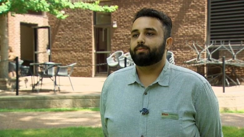 A man stands on a campus