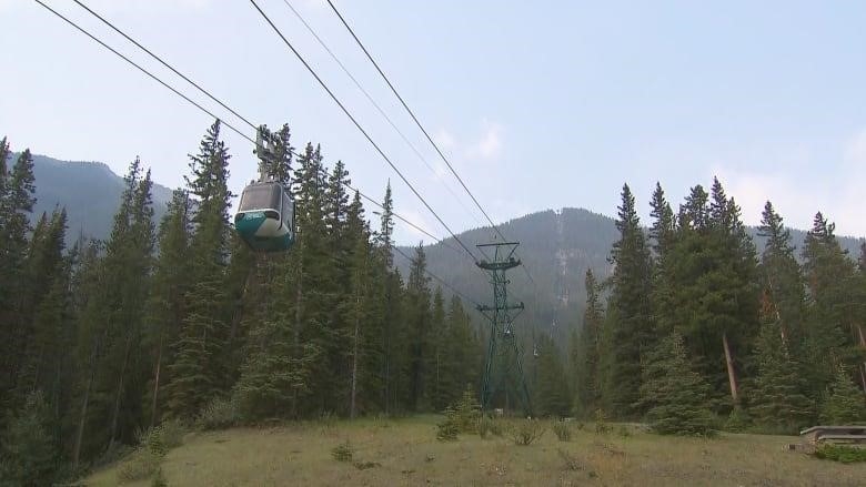 Banff Gondola with on care on the lift showing the face of Sulphur Mountain.