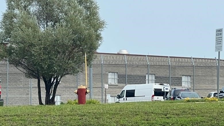 The van that transports former inmates from the CNCC to Barrie is pictured parked in a lot near the jail. 