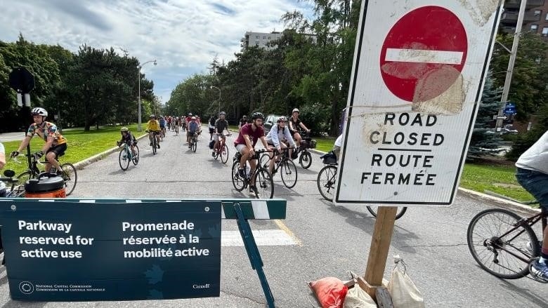 cyclists during bike rally on Queen Elizabeth Driveway, August 12, 2023