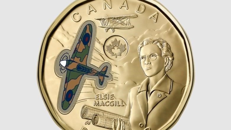 A golden coin features two planes and a woman holding blueprints.