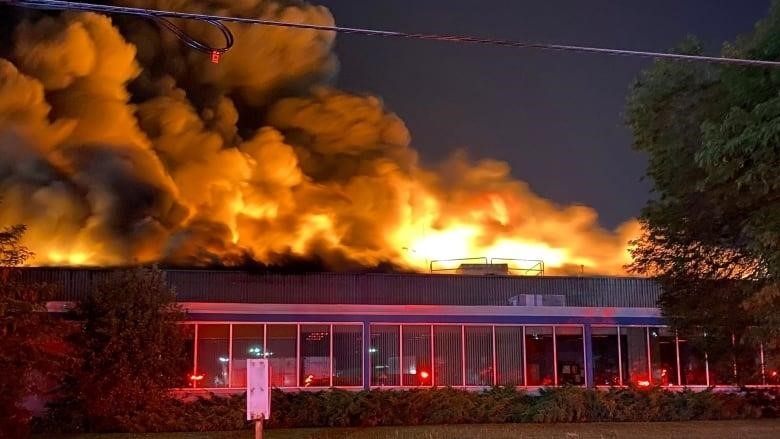 A five-alarm fire raged out of control at an industrial site in Etobicoke Friday.
