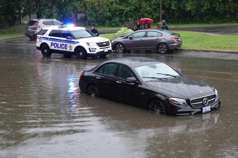 A car submerged on Kilborn Avenue, Aug. 10, 2023.